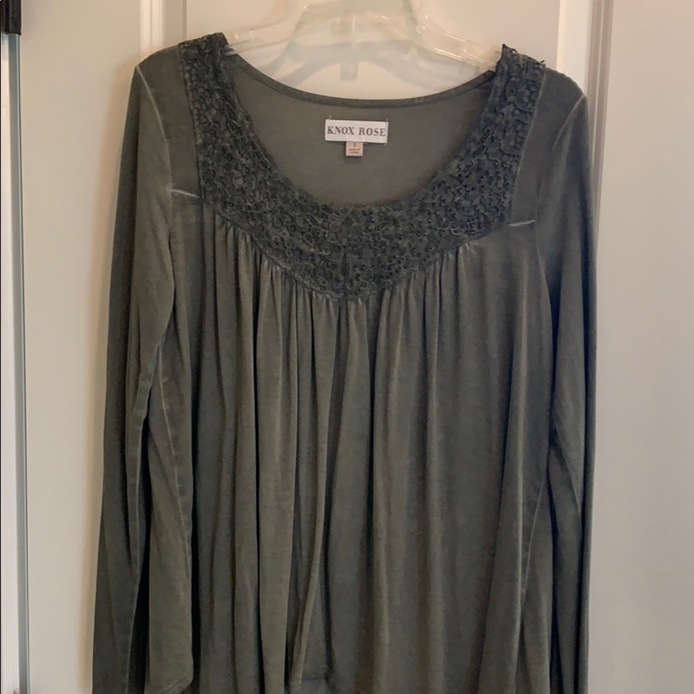 Olive colored long sleeve soft top.